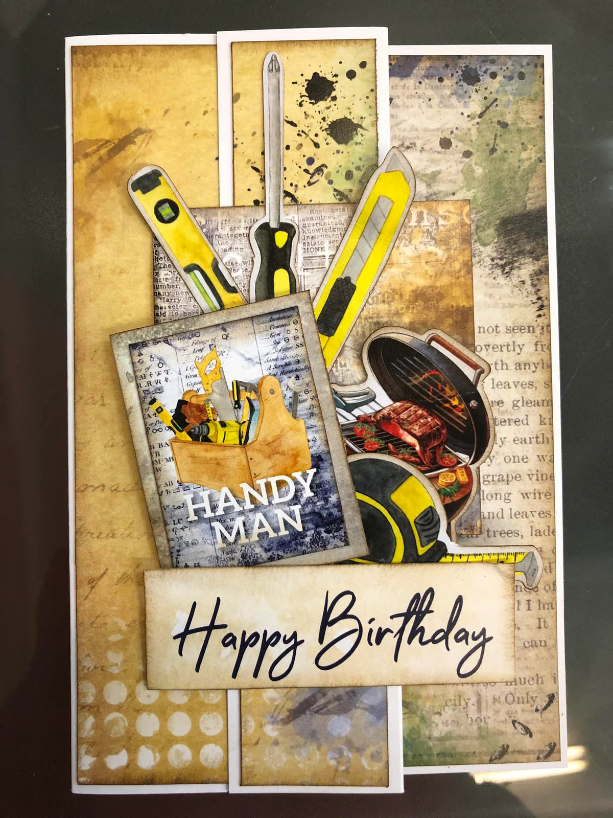 Birthday card with tools and 'Handy Man' theme on a textured background