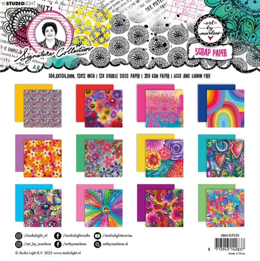 assorted paper scattered on package of scrapbook paper by art by marlene