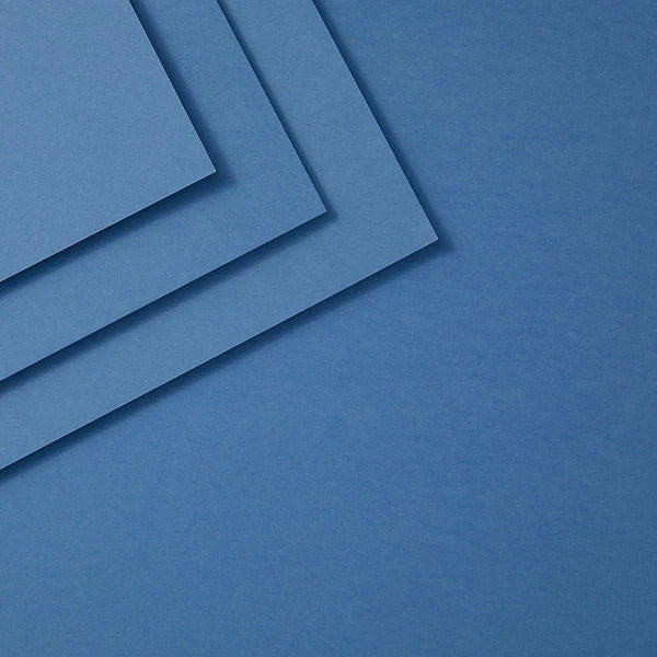 Three celestial blue sheets of paper stacked on a blue background
