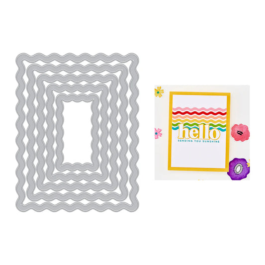 Metal die cut shapes with a greeting card featuring 'hello' and floral designs on a white background.