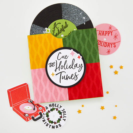 Colorful holiday-themed card with vinyl record and record player illustration on a white background.
