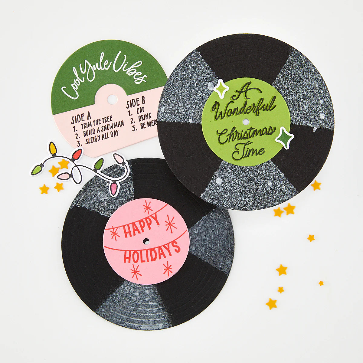Decorative vinyl records with Christmas-themed labels on a white background