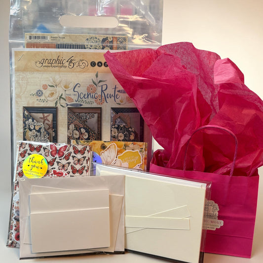 Stationery items including cards, envelopes, and a bouquet of pink flowers on a white background.