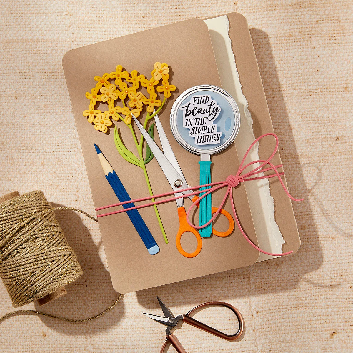 Notebook with stationery items on a textured surface