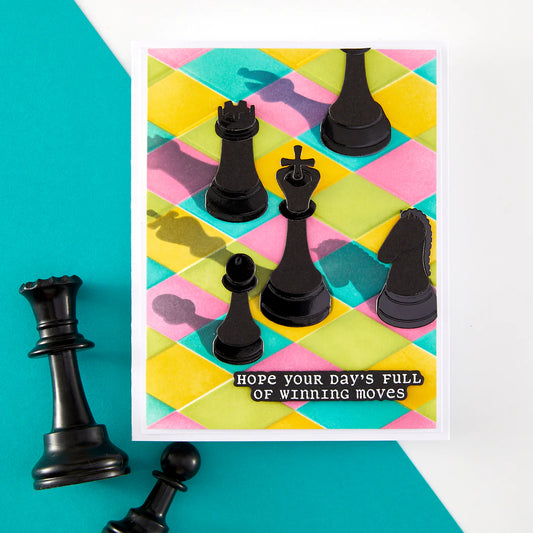 Colorful checkered background with black chess pieces and a motivational quote card
