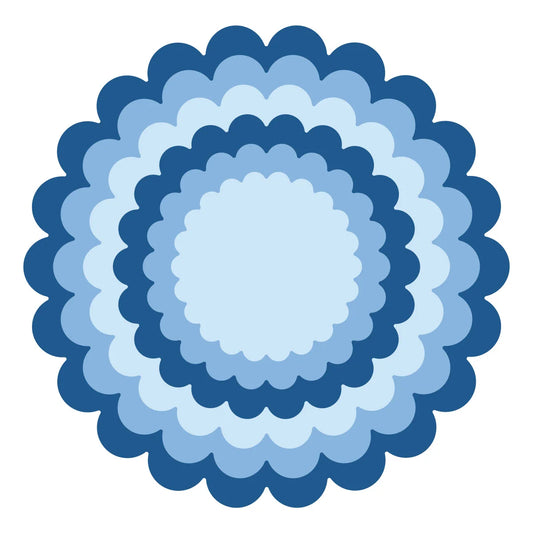 A circular scalloped floral pattern made of nested rings in multiple shades of blue, including navy, medium blue, and light blue, on a plain white background.