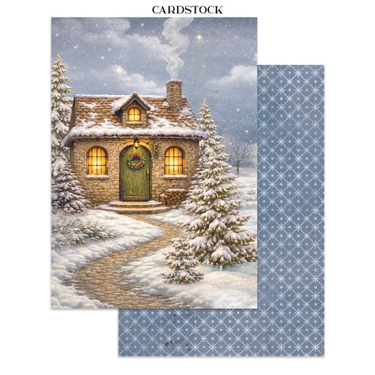Cardstock with a winter scene of a cozy house and patterned blue background