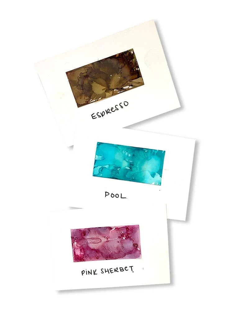 Three small white cards with abstract color swatches and handwritten labels reading Espresso, Pool, and Pink Sherbet, arranged on a white background.