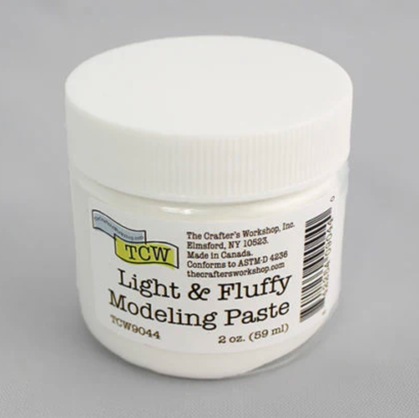 Jar of Light & Fluffy Modeling Paste with TCW branding on a gray background