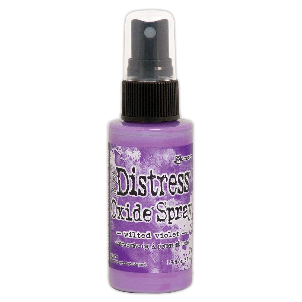 Purple bottle of Distress Oxide Spray with black spray nozzle on a white background