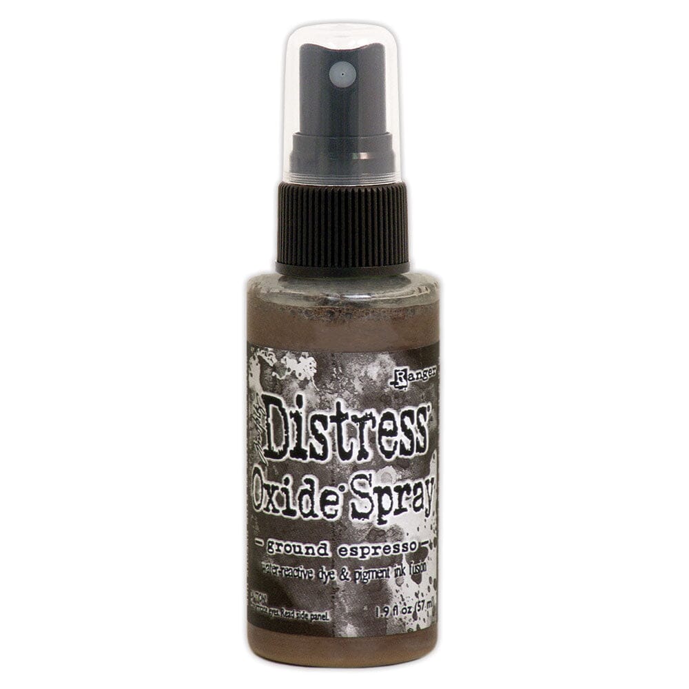 Bottle of Distress Oxide Spray with label on a white background