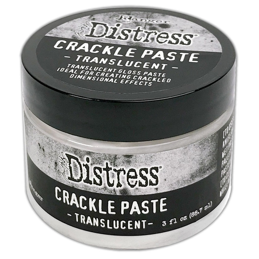A container of Tim Holtz Distress Crackle Paste Translucent, which is a clear-colored craft paste used for creating crackled effects on paper.