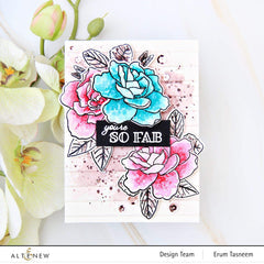 Card with floral design and 'you're so fab' text, surrounded by flowers and window slats background