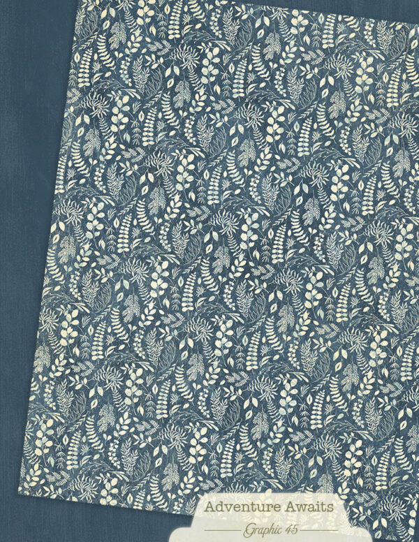 Floral patterned paper with 'Adventure Awaits' label on a dark blue background