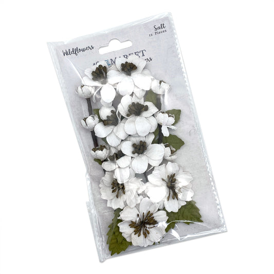 Packaged white flowers with green stems on a white background