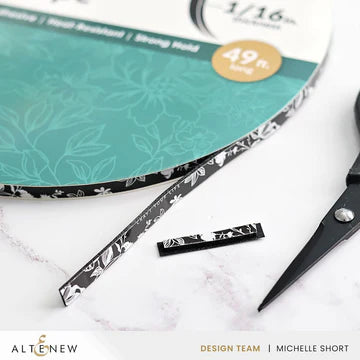 Scissors and patterned paper with 'Altenew' branding on a white background