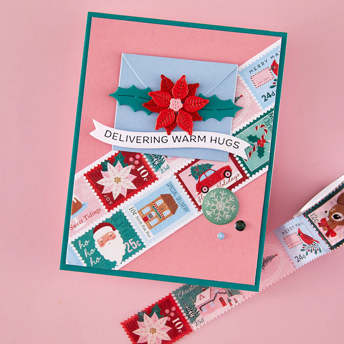 washi stamp christmas card with christmas stamped images, poinsettia, and sentiment on a pick background
