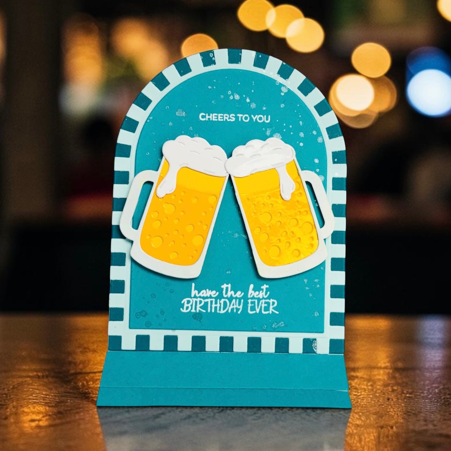 Birthday card with two beer mugs and text on a blurred background