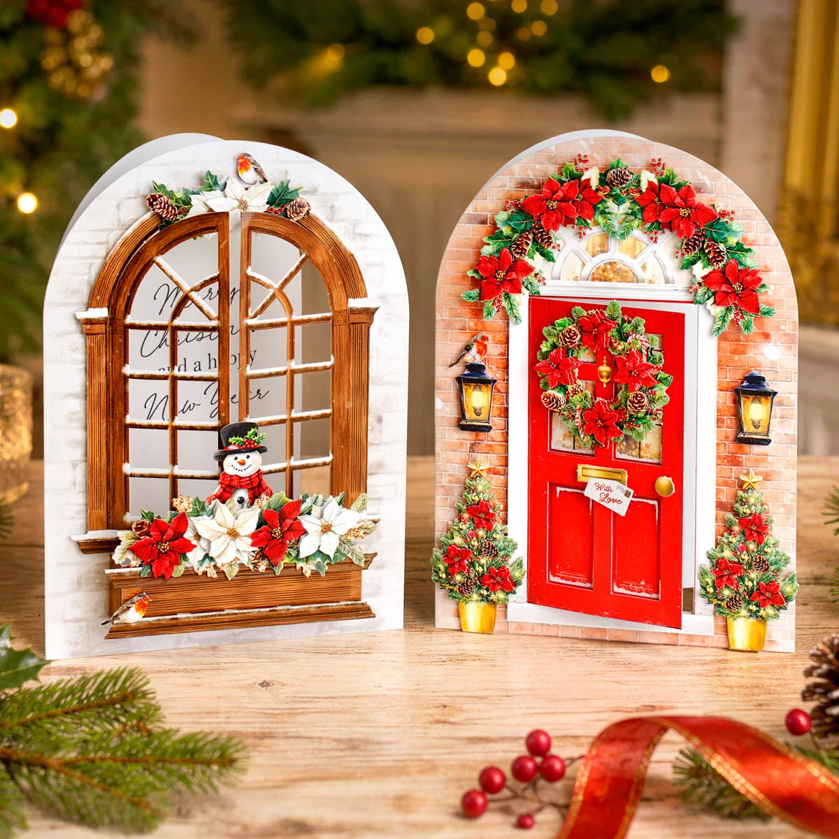 Decorative Christmas door and window arched cards with festive decorations on a wooden surface.
