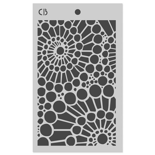 A rectangular gray stencil sheet with a circular and radial cutout pattern, shown on a plain white background. The brand initials 'CB' are printed in the top-left corner.