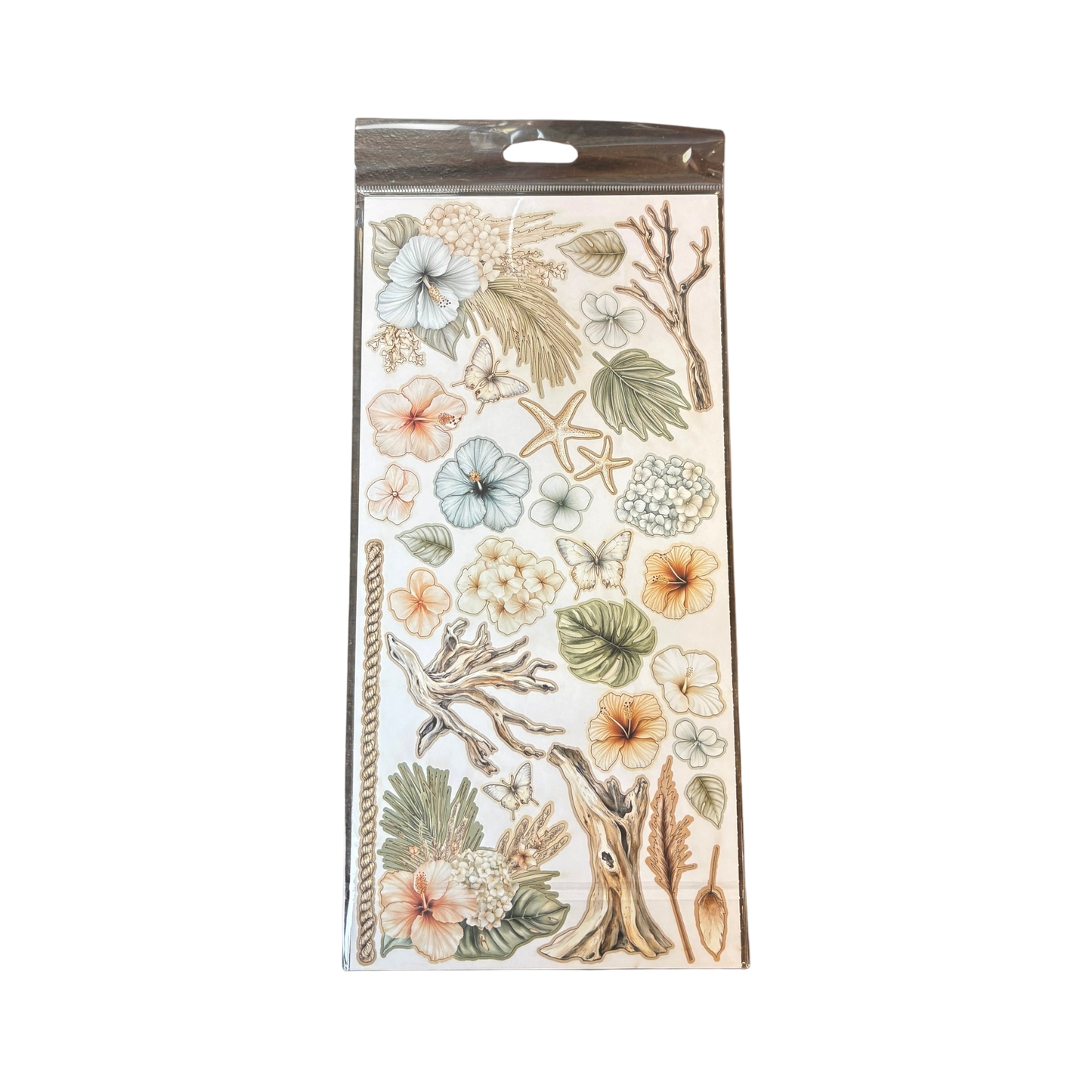A sheet of decorative botanical laser cuts in a clear plastic hanging package, featuring illustrated flowers, leaves, butterflies, starfish, and coral in soft pastel tones on a white background.