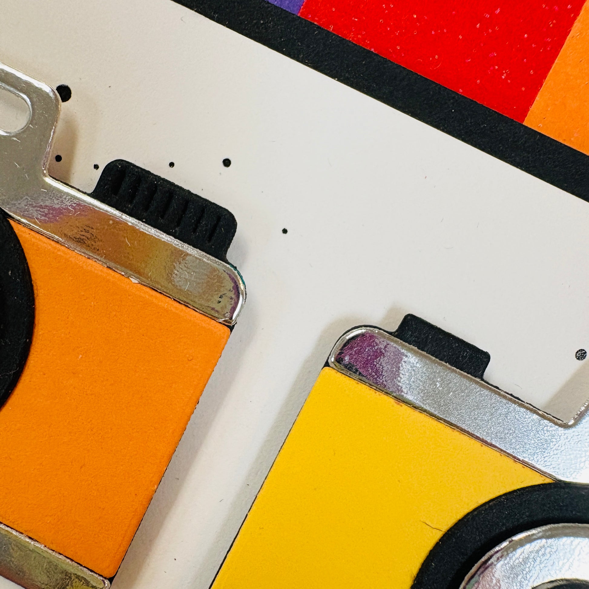 corners of cameras in orange and yellow