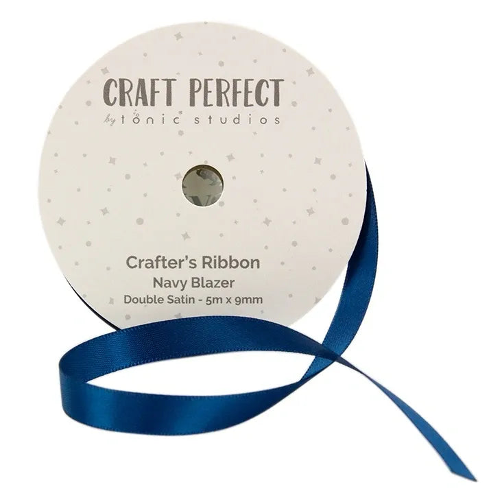 Spool of navy blue satin ribbon with 'Craft Perfect' label on a white background
