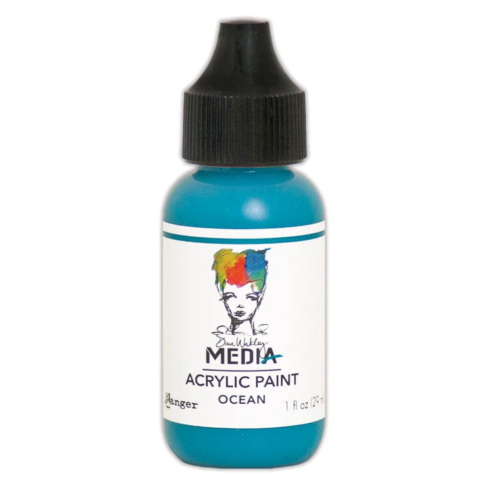 A bottle of Ranger Media Acrylic Paint in the color 'Ocean', featuring a bright turquoise blue paint inside a clear bottle with a black dropper cap and a white label.