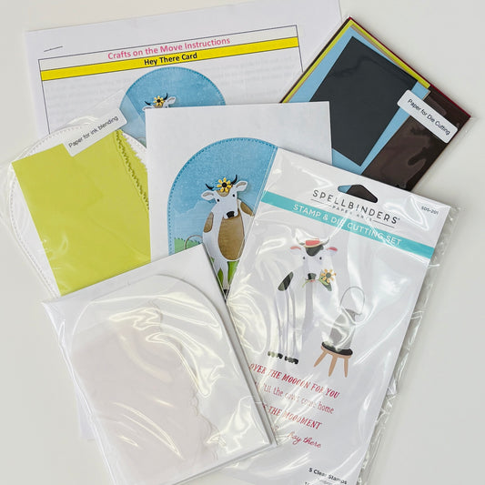 Collection of craft supplies including card templates and packaging on a white background