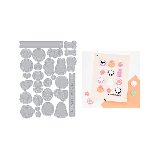 A Halloween-themed die-cut sticker set displayed alongside its metal cutting template. The stickers feature cute spooky designs like a ghost, pumpkin, cat, bat, and candy in pastel colors, with one sticker reading 'HAPPY HALLOWEEN'.