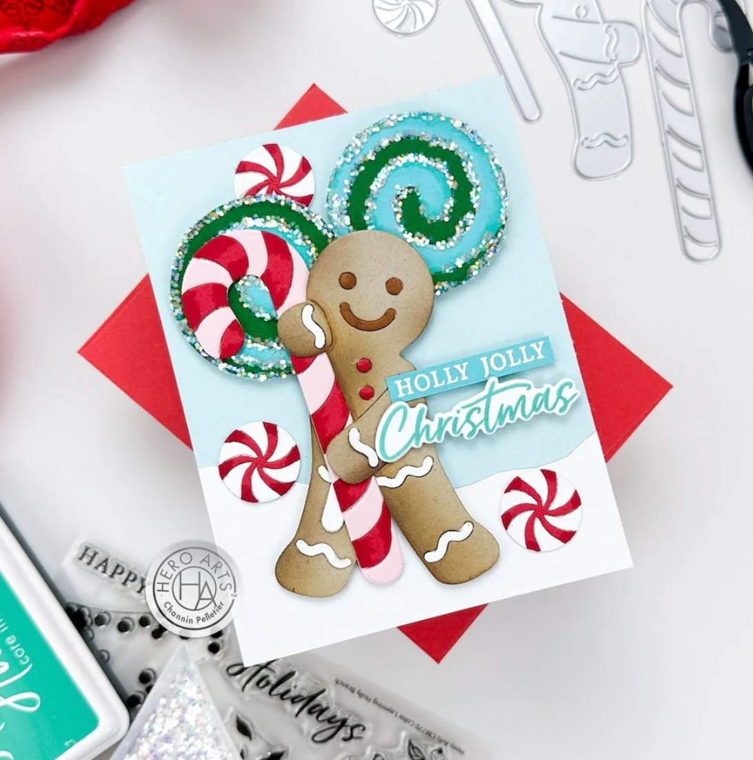 Colorful Christmas card with gingerbread man and candy cane design on a white background.