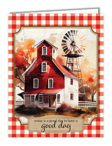 A greeting card featuring a watercolor-style illustration of a red farmhouse and windmill with autumn trees, framed by a red-and-white gingham border. The card reads, 'today is a good day to have a good day'.