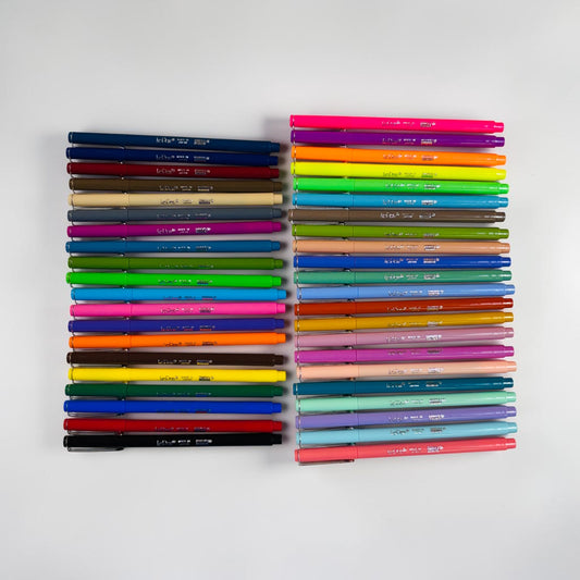 Two sets of Lamyard 9000 gel pens arranged side by side on a light gray background, showcasing a wide range of vibrant colors.