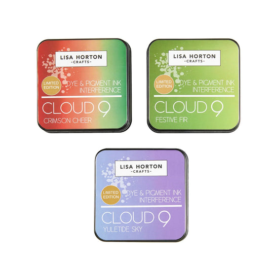 Three square ink pads from Lisa Horton Crafts arranged on a white background: Cloud 9 Crimson Cheer in red and green, Cloud 9 Festive Fr in green, and Cloud 9 Yuletide Sky in purple and blue. Each pad shows the Lisa Horton Crafts branding and the Cloud 9 line name.