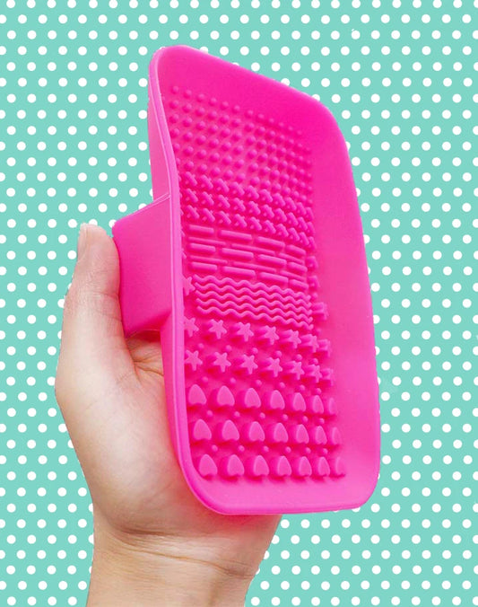 Pink silicon brush scrubber with hand grip