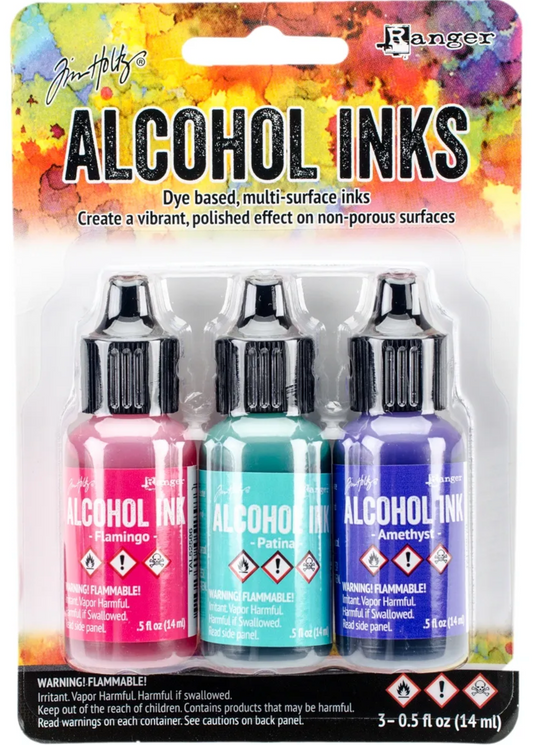 Packaging of Tim Holtz Alcohol Inks with colorful background
