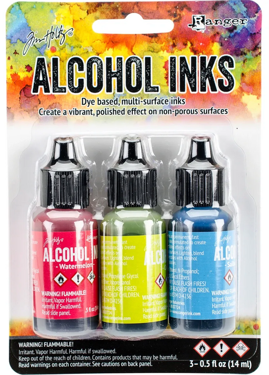 Packaging of Tim Holtz Alcohol Inks with three bottles on a colorful background