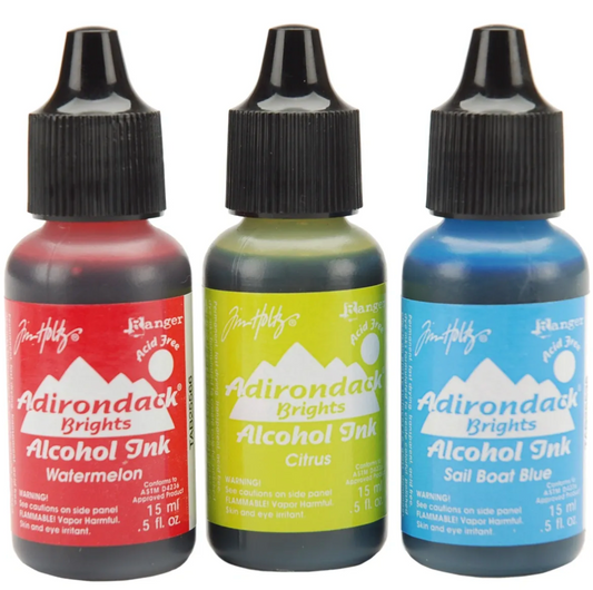 Three bottles of Adirondack Brights alcohol ink in red, green, and blue on a white background.