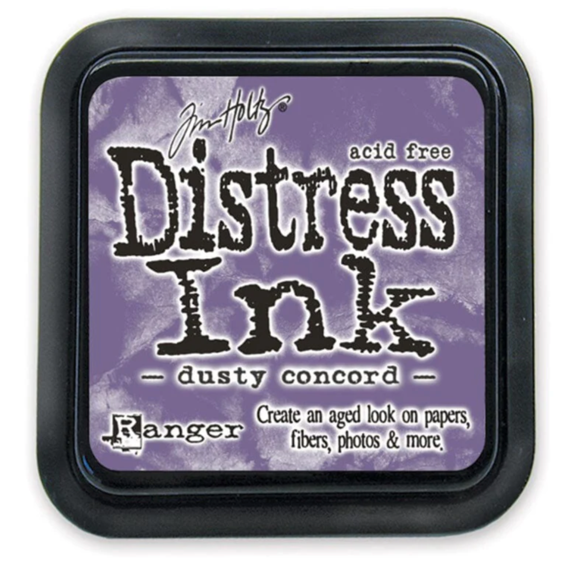 Distress Ink pad by Ranger with 'dusty concord' color on a purple background