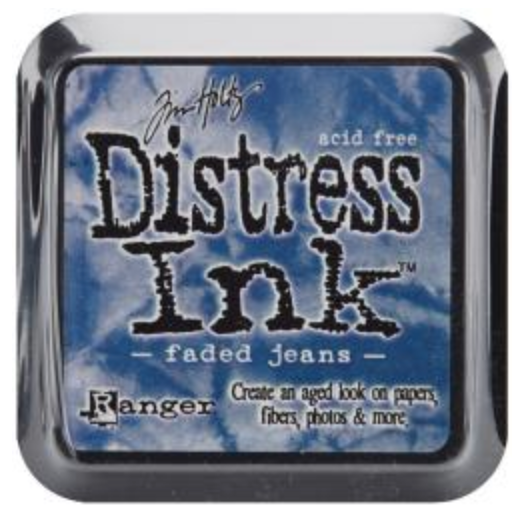Distress Ink pad by Ranger with 'faded jeans' color on a blue and white marbled background