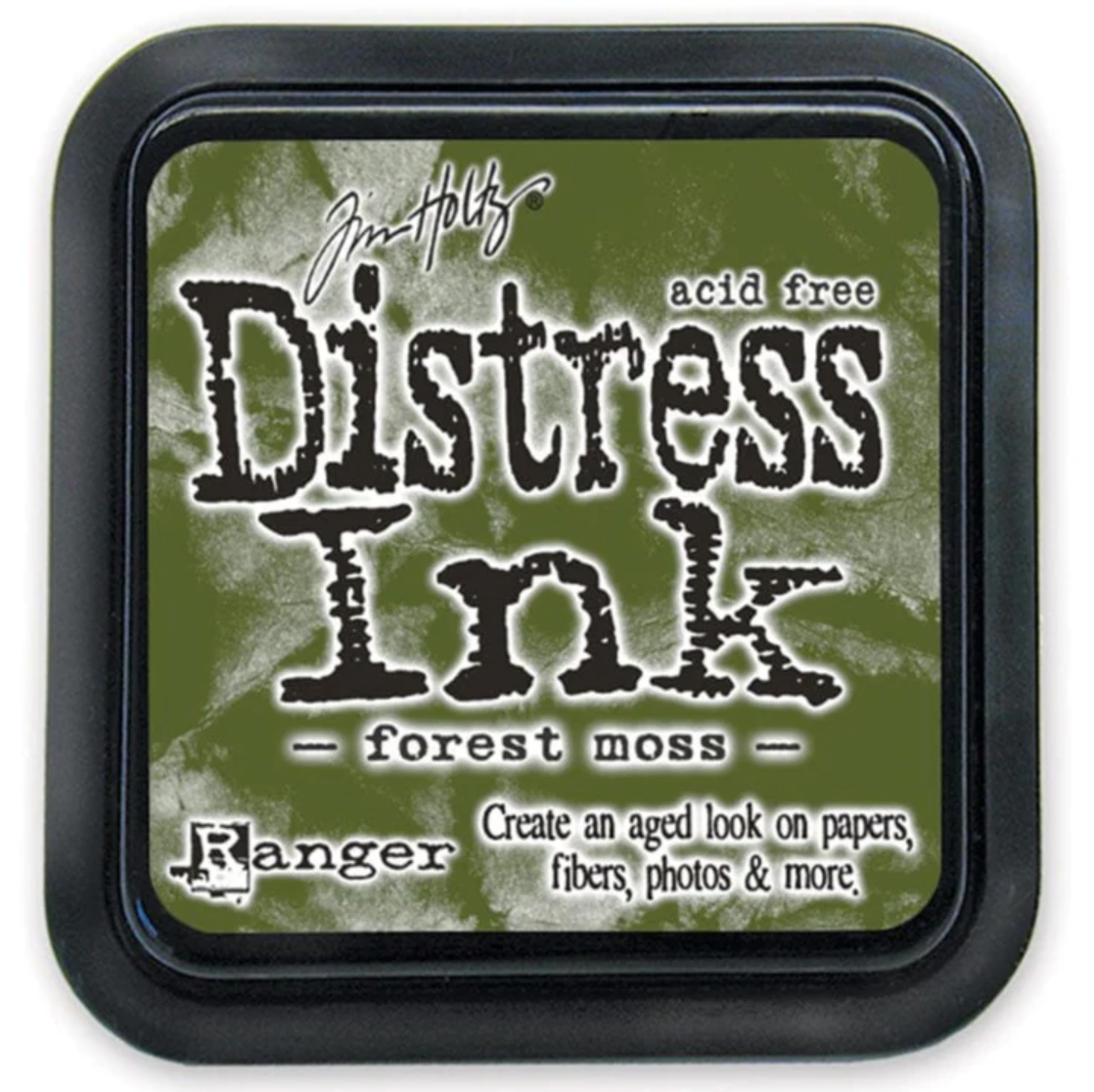 Distress Ink pad by Ranger with 'forest moss' color on a green background
