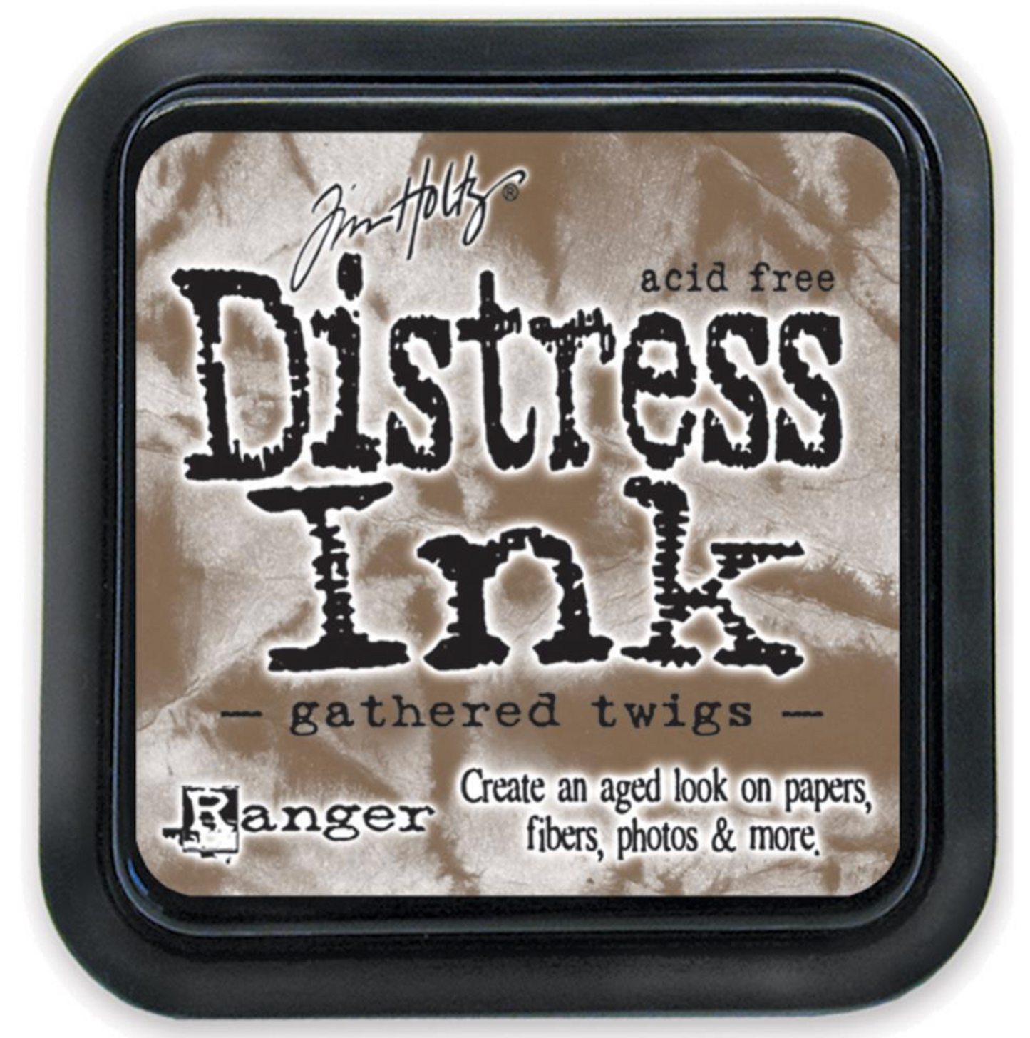 Distress Ink pad by Ranger with 'gathered twigs' color on a beige background