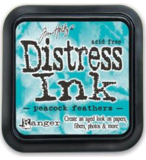 Distress Ink pad by Ranger with peacock feathers color on a blue background