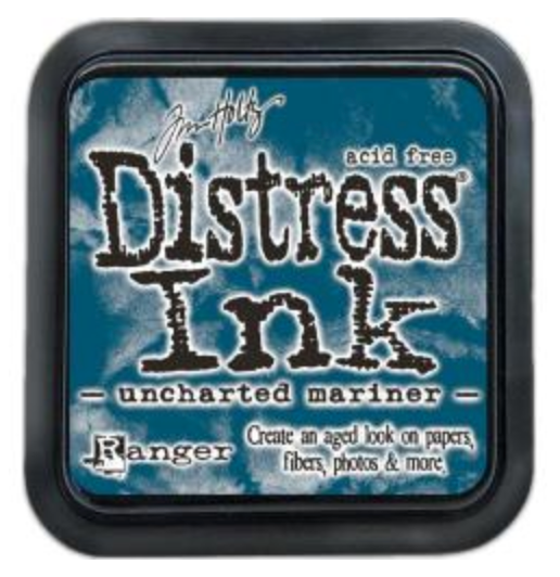 Distress Ink pad by Ranger with 'uncharted mariner' color on a blue background