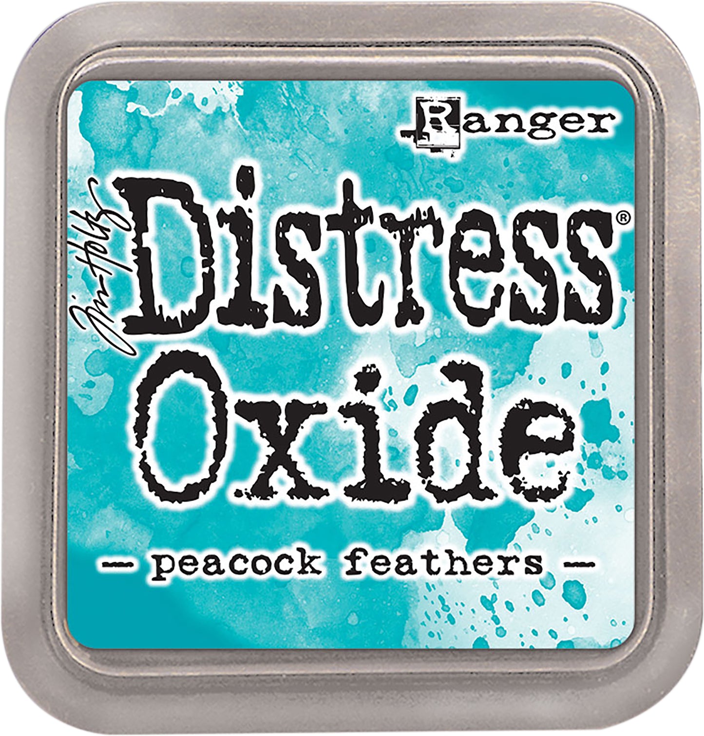 Distress Oxide ink pad by Ranger with peacock feathers color on a blue background