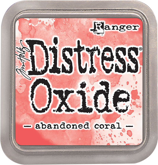 Tim Holtz Distress Oxides Ink Pad in abandoned coral color, with a water-reactive and pigment ink fusion appearance.