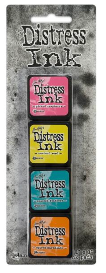 Set of Distress Ink pads in various colors on a gray background