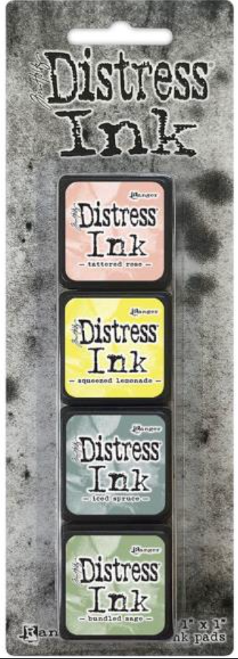 Set of Distress Ink pads on a packaging card with text and color swatches.