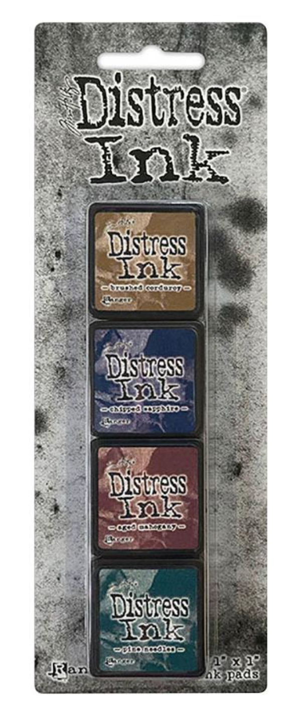Distress Ink packaging with four ink pads on a textured gray background