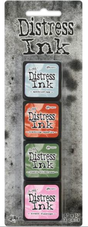 Distress Ink packaging with four ink pads on a textured background